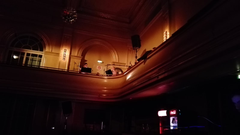 Ensemble Mosiak performing Veiled Babble from balcony.